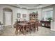 Elegant dining room features a tray ceiling, tile floors, and an abundance of natural light at 2939 Crown Bluffs Ct, Las Vegas, NV 89117
