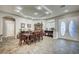 Elegant dining room features a tray ceiling, tile floors, and an abundance of natural light at 2939 Crown Bluffs Ct, Las Vegas, NV 89117