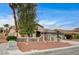 Charming single-story home featuring a three-car garage and drought-resistant landscaping at 2939 Crown Bluffs Ct, Las Vegas, NV 89117