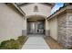 Charming home featuring a welcoming front entrance, decorative stone accents, and a well-maintained walkway at 2939 Crown Bluffs Ct, Las Vegas, NV 89117