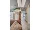 Hallway leading into the house, connecting to the kitchen and featuring an antique grandfather clock at 2939 Crown Bluffs Ct, Las Vegas, NV 89117