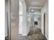 Hallway leading to the bathroom and dining room featuring tiled flooring at 2939 Crown Bluffs Ct, Las Vegas, NV 89117