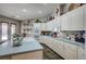 Spacious kitchen featuring a central island, double ovens, and ample countertop space at 2939 Crown Bluffs Ct, Las Vegas, NV 89117