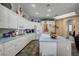 Bright kitchen with white cabinets, a light countertop island, and lots of space for storage at 2939 Crown Bluffs Ct, Las Vegas, NV 89117