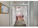 View into the main bedroom suite showcasing tray ceilings, ceiling fan, and hardwood floors at 2939 Crown Bluffs Ct, Las Vegas, NV 89117