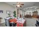 View of the home office, opening to the living room, and showing neutral walls and flooring at 2939 Crown Bluffs Ct, Las Vegas, NV 89117