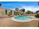 Inviting backyard pool with slide, landscaping and perimeter walls at 2939 Crown Bluffs Ct, Las Vegas, NV 89117