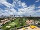 Stunning aerial view of a lush golf course community with the Las Vegas skyline in the background at 3111 Bel Air Dr # 15G, Las Vegas, NV 89109
