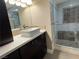Bathroom featuring sleek dark wood cabinets, a vessel sink, and glass walk-in shower at 3111 Bel Air Dr # 15G, Las Vegas, NV 89109