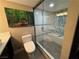 Elegant bathroom featuring a stylish glass-enclosed shower with decorative tile accents and modern fixtures at 3111 Bel Air Dr # 15G, Las Vegas, NV 89109
