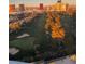 Expansive golf course view with sand traps and city skyline in the background at sunrise at 3111 Bel Air Dr # 15G, Las Vegas, NV 89109