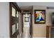 Hallway with modern art and sliding doors at 3111 Bel Air Dr # 15G, Las Vegas, NV 89109