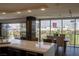 Modern kitchen with stainless steel appliances, island countertop and views of the city at 3111 Bel Air Dr # 15G, Las Vegas, NV 89109