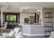 Open-concept kitchen with counter seating, dining table and painting at 3111 Bel Air Dr # 15G, Las Vegas, NV 89109