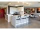 Modern kitchen with white cabinetry, breakfast bar, and stainless steel appliances at 3111 Bel Air Dr # 15G, Las Vegas, NV 89109