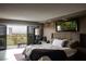 Comfortable bedroom features balcony access with golf course view, seating, and warm decor at 3111 Bel Air Dr # 15G, Las Vegas, NV 89109