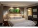 Cozy main bedroom with serene bamboo art and a view of the ensuite bathroom at 3111 Bel Air Dr # 15G, Las Vegas, NV 89109
