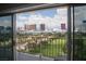 Balcony view showcasing a golf course and the prominent buildings of the Vegas skyline at 3111 Bel Air Dr # 15G, Las Vegas, NV 89109