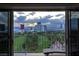 Balcony view showcasing a golf course and the prominent buildings of the Vegas skyline at 3111 Bel Air Dr # 15G, Las Vegas, NV 89109