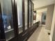 Elaborate closet area with dark paneled doors, drawers, and access to bathroom at 3111 Bel Air Dr # 15G, Las Vegas, NV 89109