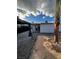 Private backyard featuring modern hardscape, stucco exterior, and pergola-covered patio at 321 Beaumont St, Las Vegas, NV 89106