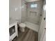 Bathroom featuring a glass door shower, modern sink, vanity and toilet at 321 Beaumont St, Las Vegas, NV 89106