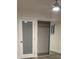 Bedroom featuring bright walls and floor, and closet with mirror doors and bright ceiling fan at 321 Beaumont St, Las Vegas, NV 89106