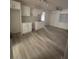 Spacious room with natural lighting, wood floors, and ceiling fan at 321 Beaumont St, Las Vegas, NV 89106