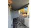 Covered patio and modern hardscape backyard with a small palm tree at 321 Beaumont St, Las Vegas, NV 89106