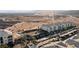 A high angle view of a condo complex with multiple buildings, covered parking, a pool and tennis courts with desert landscape views at 3550 Bay Sands Dr # 1003, Laughlin, NV 89029