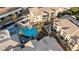 Aerial view of community pool, spa and lounge area surrounded by beautiful condominiums and desert landscape views at 3550 Bay Sands Dr # 1003, Laughlin, NV 89029