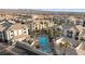 Aerial view showcasing a community pool, spa, palm trees, and well-maintained condo buildings at 3550 Bay Sands Dr # 1003, Laughlin, NV 89029