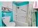 Bathroom boasts a shower and tub combination with blue accents and organized storage at 3550 Bay Sands Dr # 1003, Laughlin, NV 89029