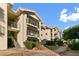 Exterior view of condo buildings with manicured landscaping, staircases, and private balconies at 3550 Bay Sands Dr # 1003, Laughlin, NV 89029