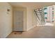 Cozy apartment front door with security screen, colorful welcome mat, and outdoor staircase access at 3550 Bay Sands Dr # 1003, Laughlin, NV 89029