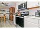 Bright kitchen features stainless steel appliances, white cabinets, and a classic china cabinet at 3550 Bay Sands Dr # 1003, Laughlin, NV 89029