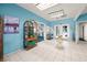 The condo complex lobby has beautiful porcelain floors, high ceilings, bright paint and elegant furniture at 3550 Bay Sands Dr # 1003, Laughlin, NV 89029