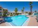 Community swimming pool with surrounding landscaping and lounge chairs at 3550 Bay Sands Dr # 1003, Laughlin, NV 89029