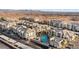 Aerial view of the community, showing the pool, landscaping, and desert backdrop at 3550 Bay Sands Dr # 2101, Laughlin, NV 89029