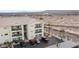 Aerial view of a condominium complex with desert landscaping and mountain backdrop at 3550 Bay Sands Dr # 2101, Laughlin, NV 89029