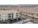 Aerial view of condominiums with desert landscaping, parking, and mountain views at 3550 Bay Sands Dr # 2101, Laughlin, NV 89029