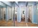 Bright bathroom featuring wood-look floors and a mirrored closet leading to a vanity and toilet area at 3550 Bay Sands Dr # 2101, Laughlin, NV 89029