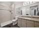 Bathroom featuring a large mirror over granite-topped vanity and a walk-in shower with a handheld shower head at 3550 Bay Sands Dr # 2101, Laughlin, NV 89029