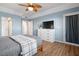 Serene bedroom with an ensuite bathroom, double door closet, and hardwood floors at 3550 Bay Sands Dr # 2101, Laughlin, NV 89029