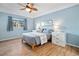 Calming bedroom with a ceiling fan, hardwood floors, and views to exterior at 3550 Bay Sands Dr # 2101, Laughlin, NV 89029