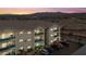 Condo building featuring balconies with stylish railings, set against a backdrop of mountains and desert landscape at 3550 Bay Sands Dr # 2101, Laughlin, NV 89029