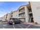 Apartment building exterior with balconies and stairs and a parked van at 3550 Bay Sands Dr # 2101, Laughlin, NV 89029
