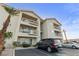 Apartment building exterior with balconies, stairs, and parking at 3550 Bay Sands Dr # 2101, Laughlin, NV 89029