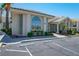 Condominium building exterior with large windows, lush landscaping, and ample parking at 3550 Bay Sands Dr # 2101, Laughlin, NV 89029