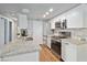 Modern kitchen equipped with stainless steel appliances, granite countertops, and sleek white cabinetry at 3550 Bay Sands Dr # 2101, Laughlin, NV 89029